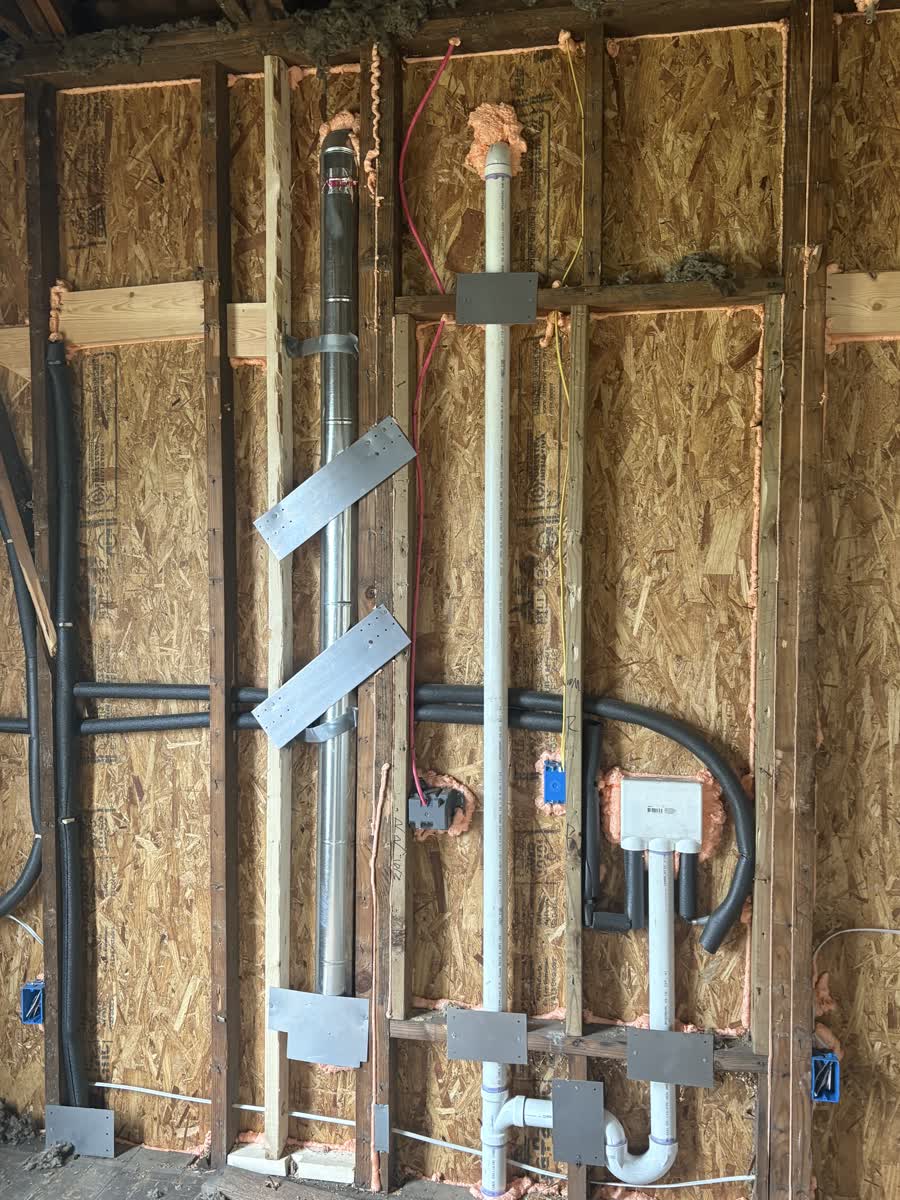 Summit Building plubmbing or exahust on unfished wall